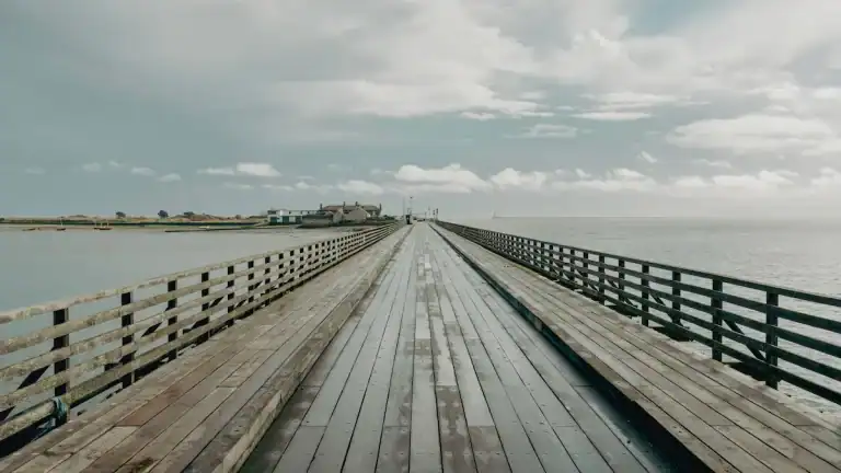 A long wooden bridge stretching forward, symbolizing a two-year life change and intentional transition.