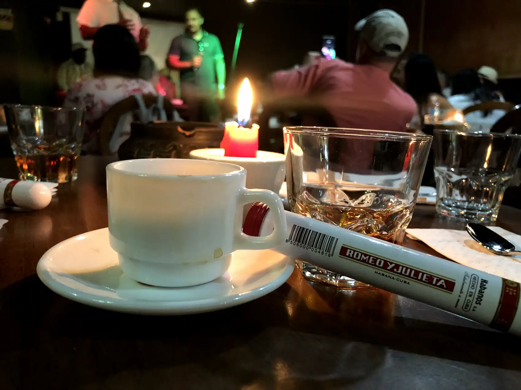 Cuban cigar coffee and rum on table at authentic salsa cafe in Havana Cuba