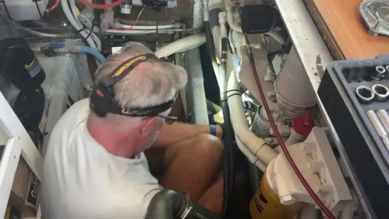 Matt working in the engine room of a liveaboard yacht