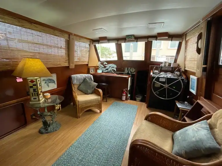 Interior salon and helm of a classic motor yacht set up like a living room