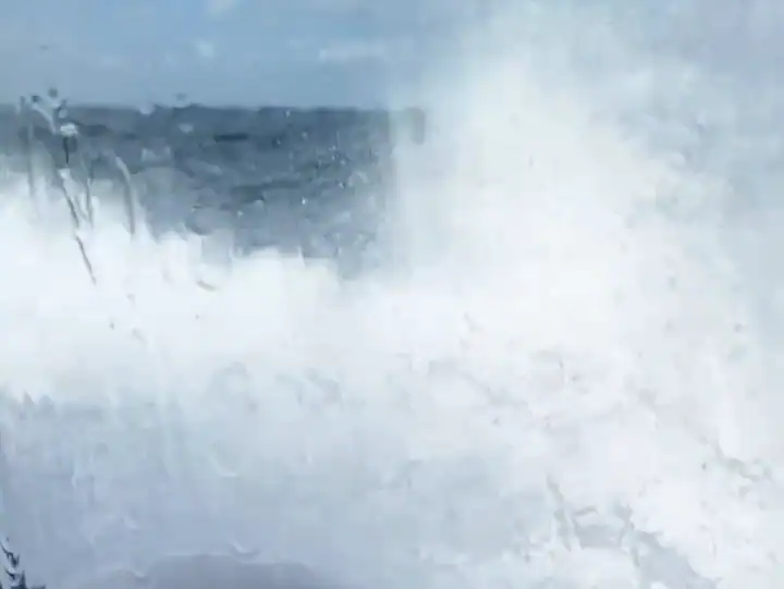 Sea spray hitting the boat window on the Cliffs of Moher boat ride