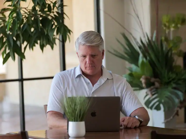 Matt Lutz sitting at a laptop with a thoughtful look, weighing the question is it too late to change my life