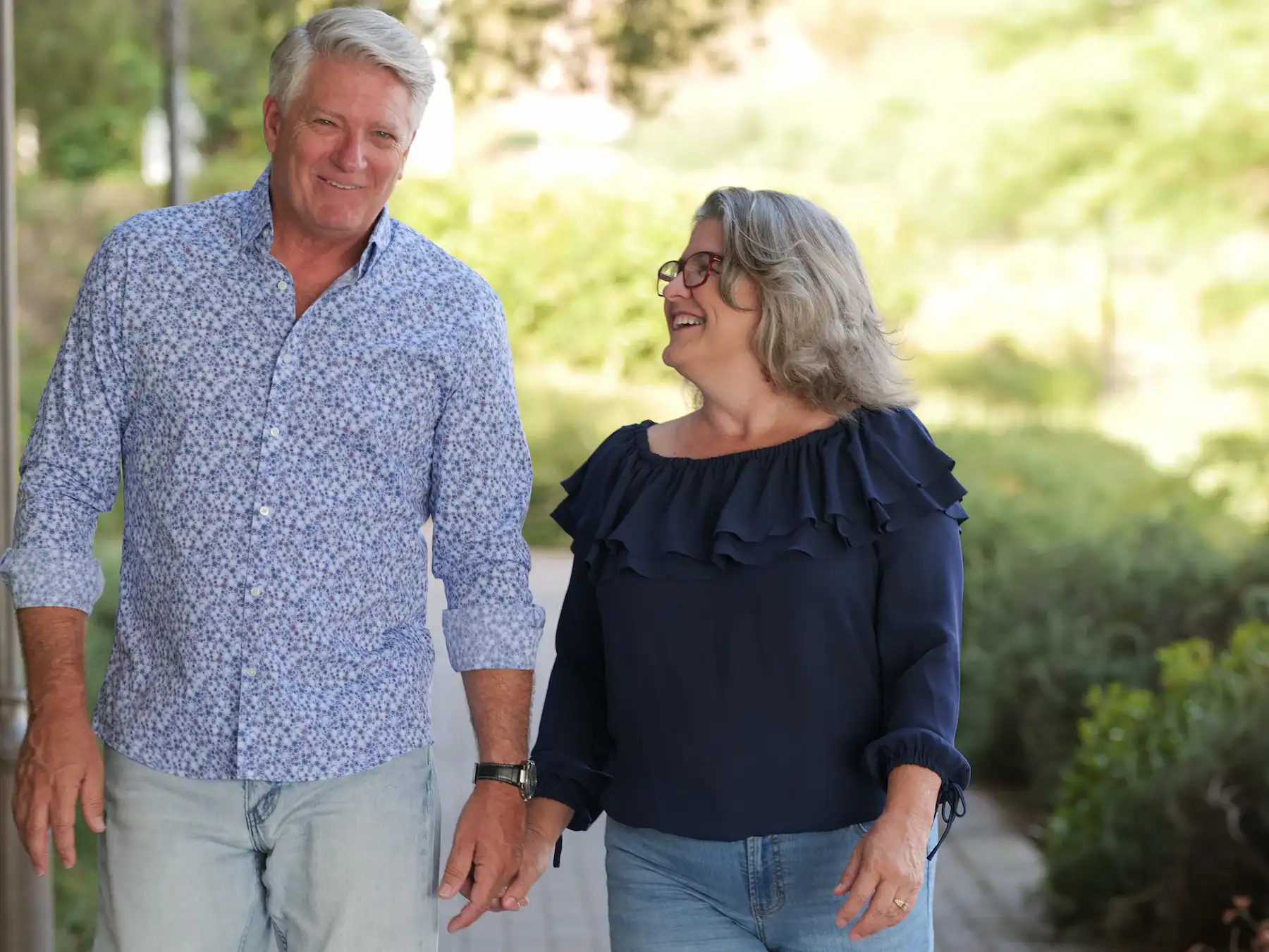 Matt and Linda Lutz walking side by side, a couple who learned that real partnership in marriage means taking turns carrying each other